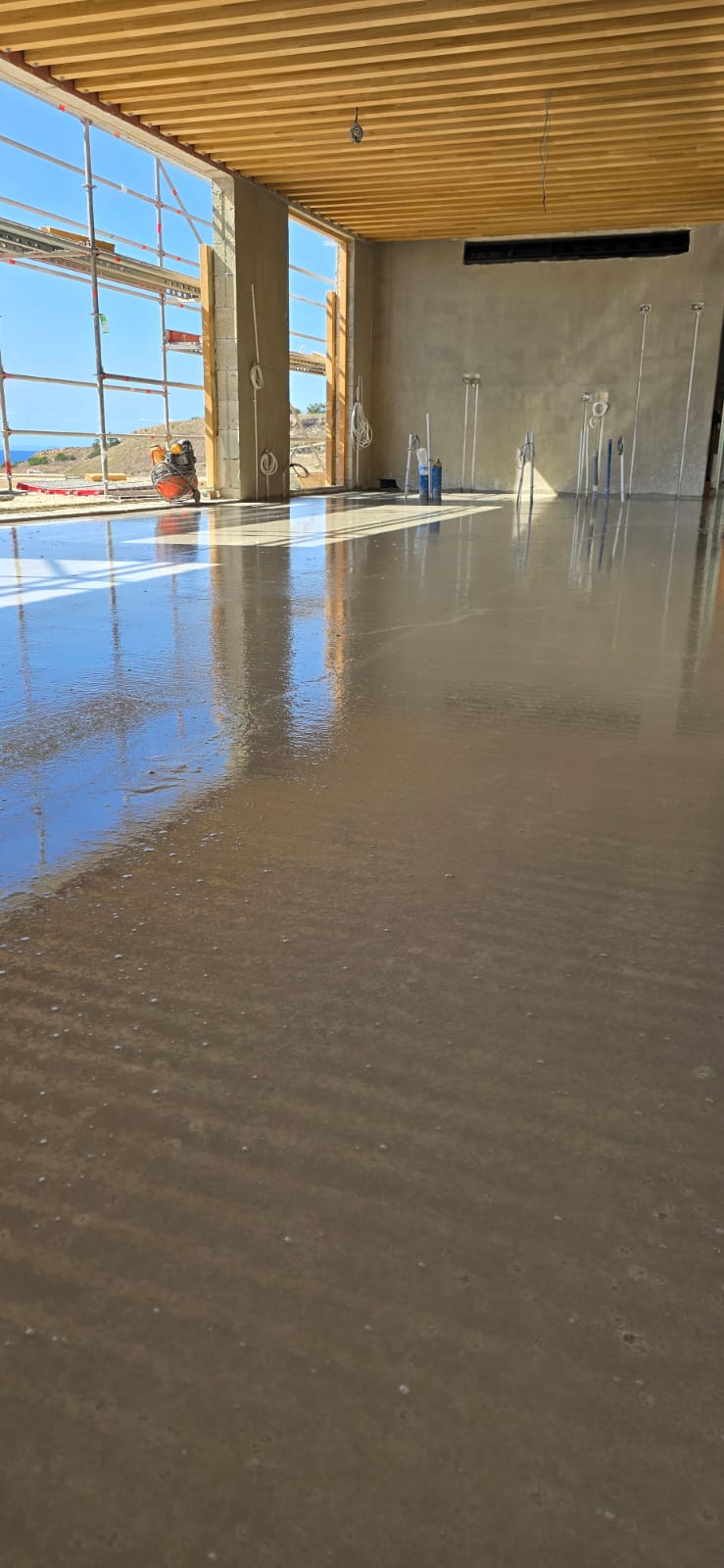 Self-levelling screed being poured, Malta